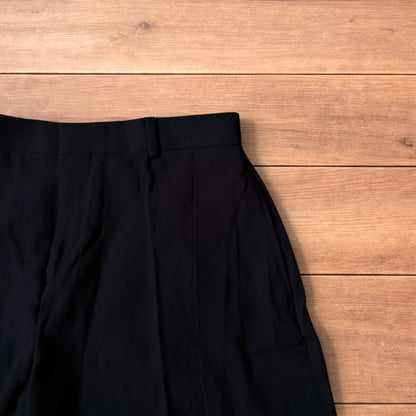 Super baggy wide tailored pleated linen shorts jorts in black.