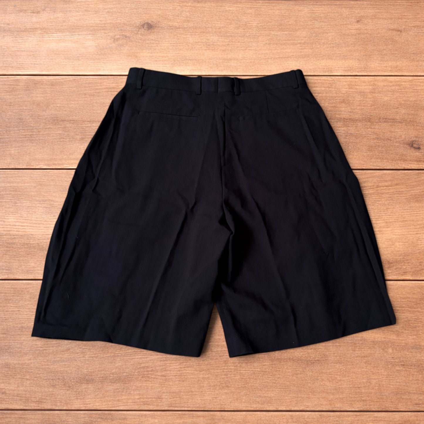 Super baggy wide tailored pleated linen shorts jorts in black.