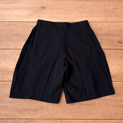 Super baggy wide tailored pleated linen shorts jorts in black.