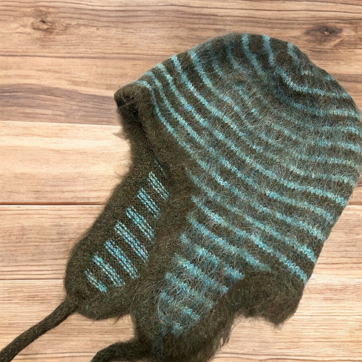 Lovely vintage style knitted ear flap hat bonnet in green/brown stripes. One size.