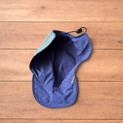 Lightweight reversible military pilot trapper hat in green/purple.