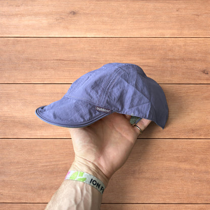 Lightweight reversible military pilot trapper hat in green/purple.