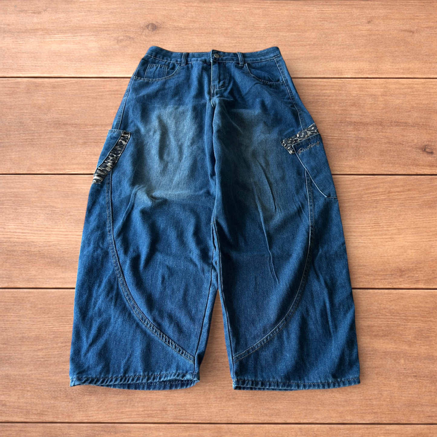 Incredible vintage style baggy wide leg skater fit jeans with leopard print in mid blue.