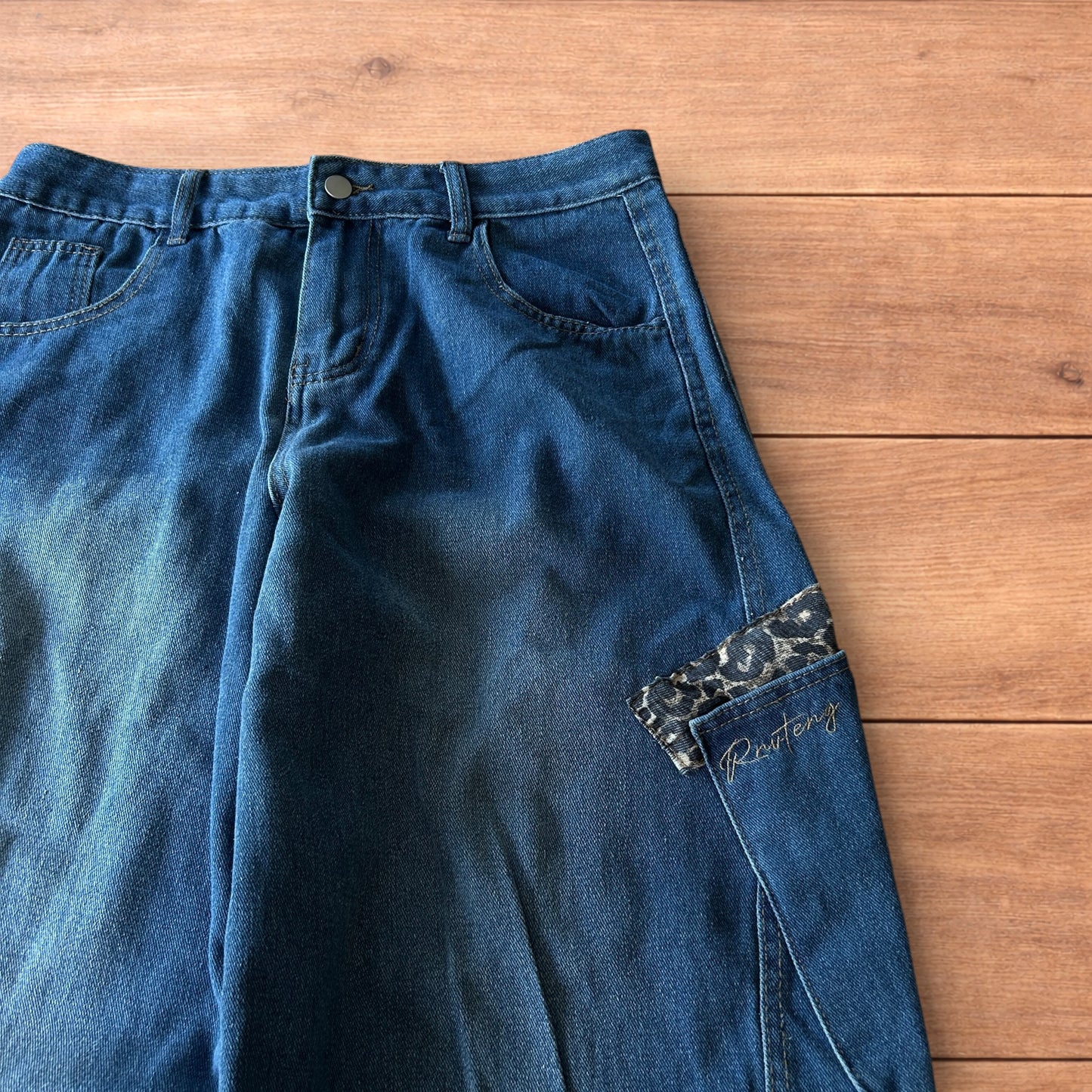 Incredible vintage style baggy wide leg skater fit jeans with leopard print in mid blue.