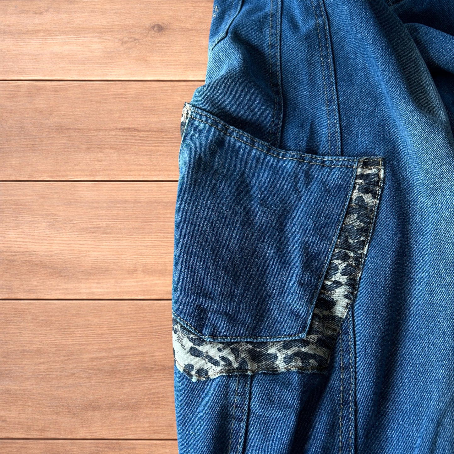 Incredible vintage style baggy wide leg skater fit jeans with leopard print in mid blue.