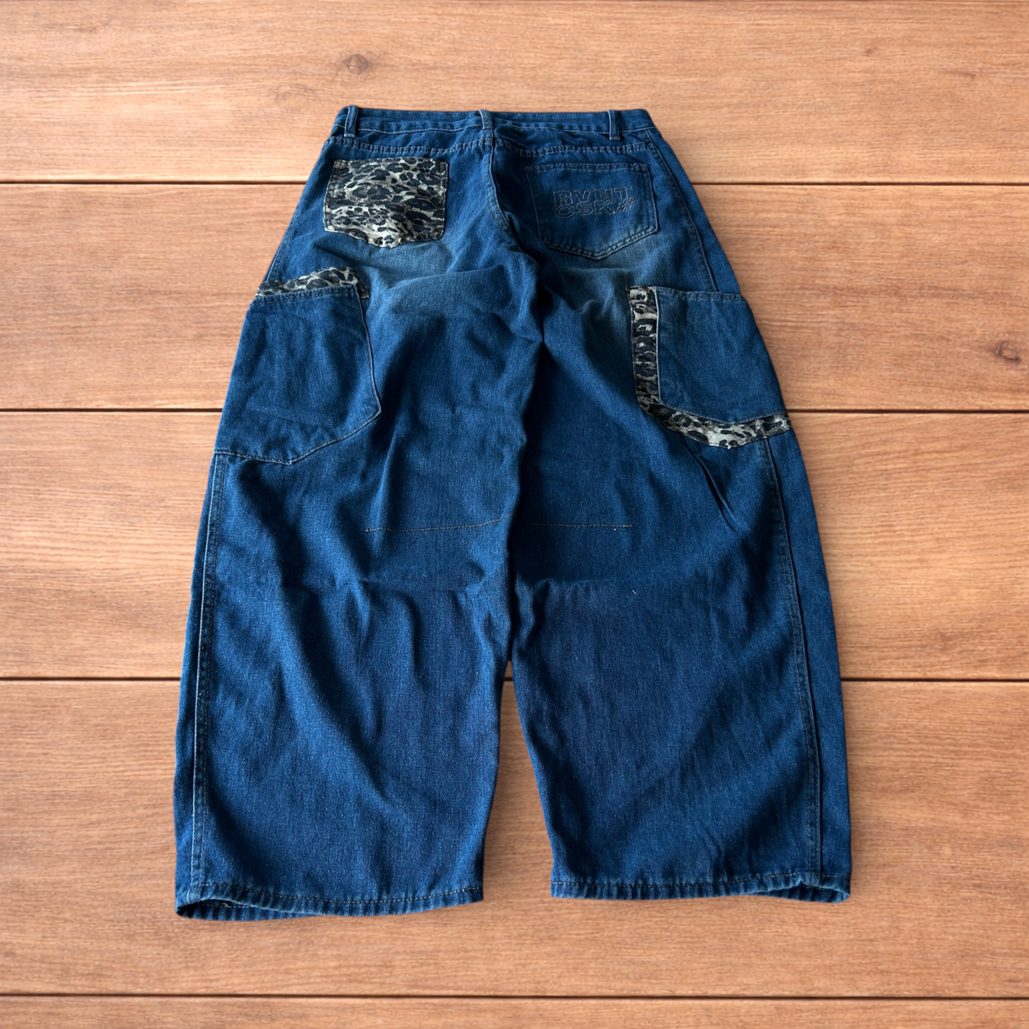 Incredible vintage style baggy wide leg skater fit jeans with leopard print in mid blue.