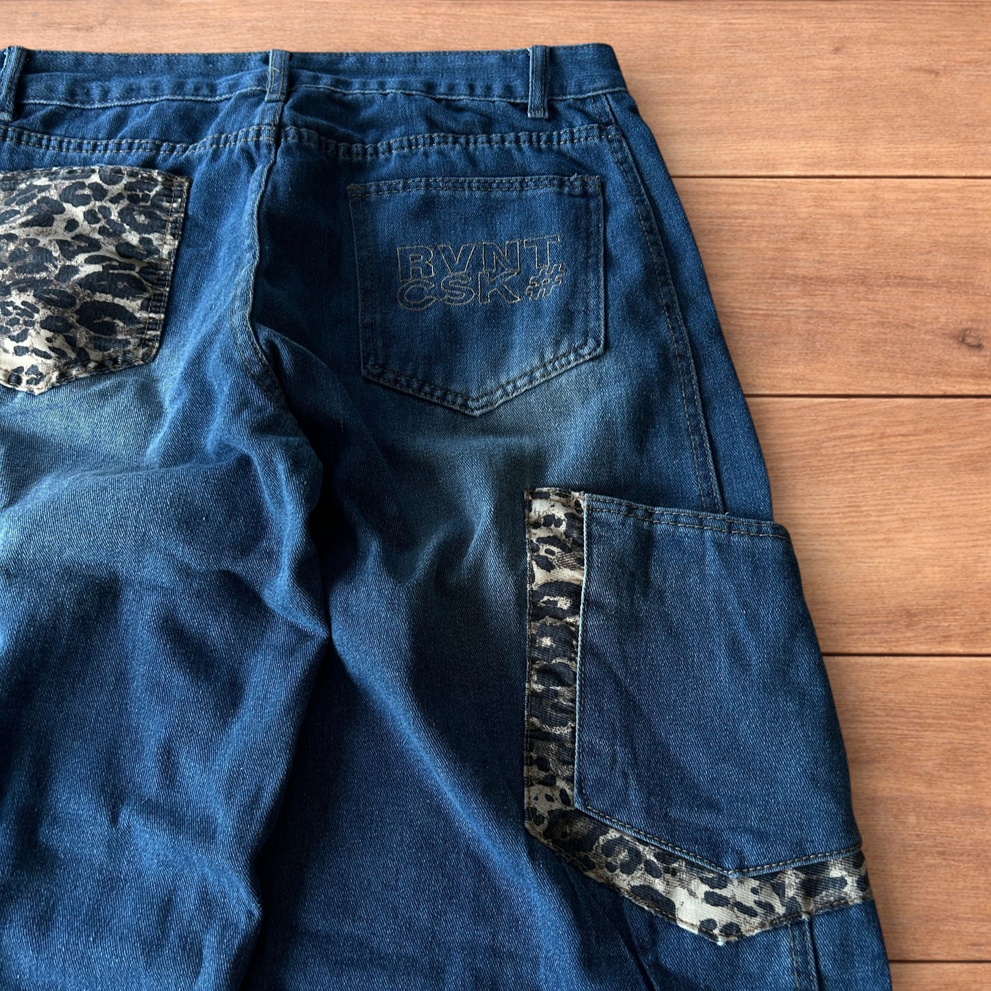 Incredible vintage style baggy wide leg skater fit jeans with leopard print in mid blue.