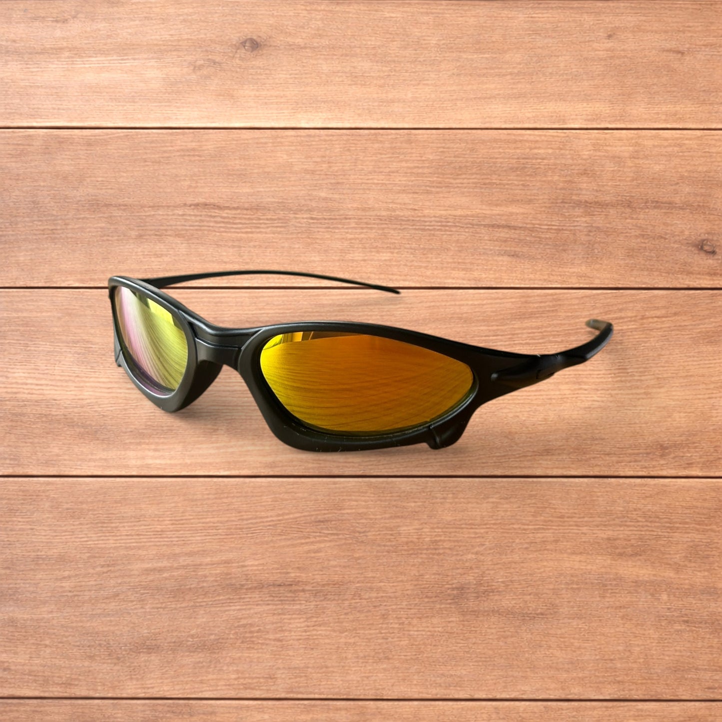 Insane polarised sunglasses in black with orange reflective lense.