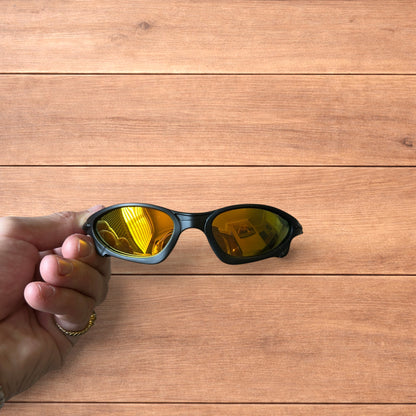 Insane polarised sunglasses in black with orange reflective lense.