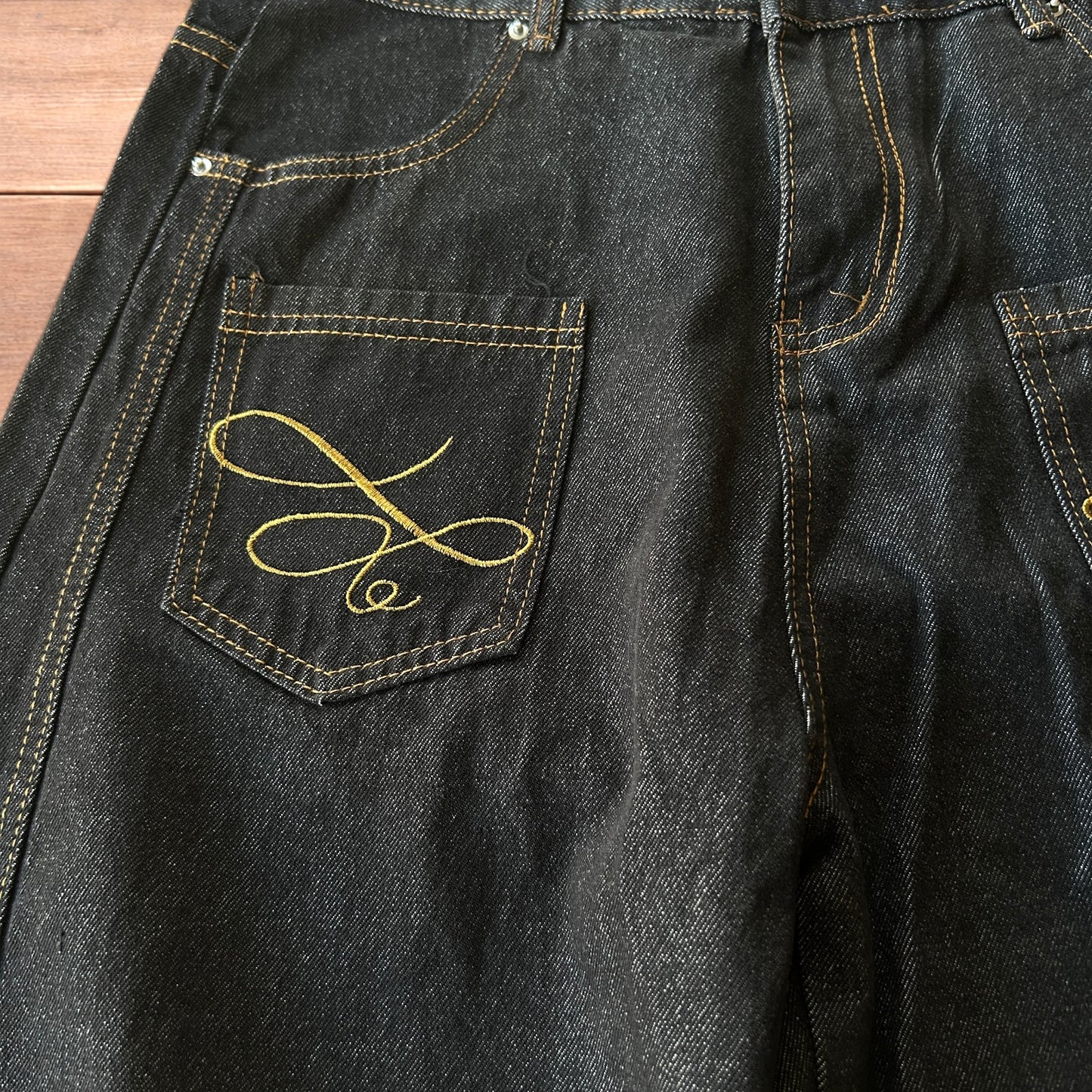 Vintage style baggy wide leg Korean fit jeans with embroidery in black.