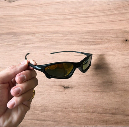 Insane polarised sunglasses in black with orange reflective lense. One size.