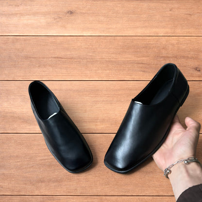 Lovely faux leather slip on loafers shoes in black.