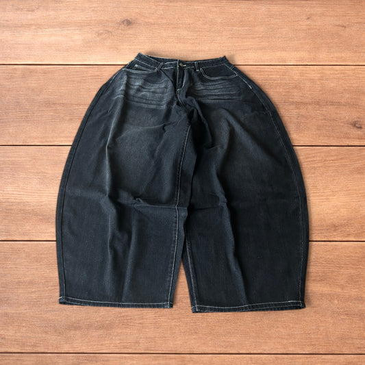 Super baggy wide leg balloon fit jeans in washed black.