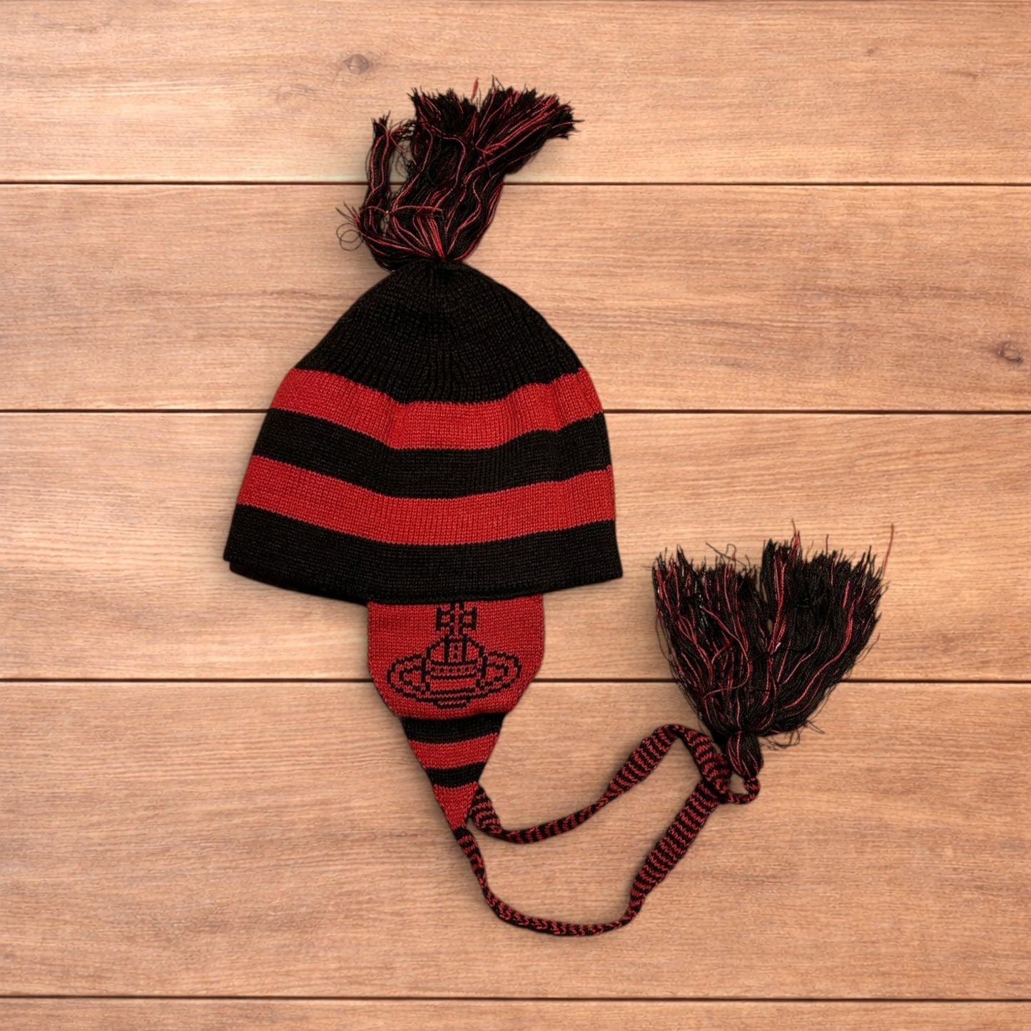 Lovely vintage style Dappy ear flap bobble hat in black/red stripes.