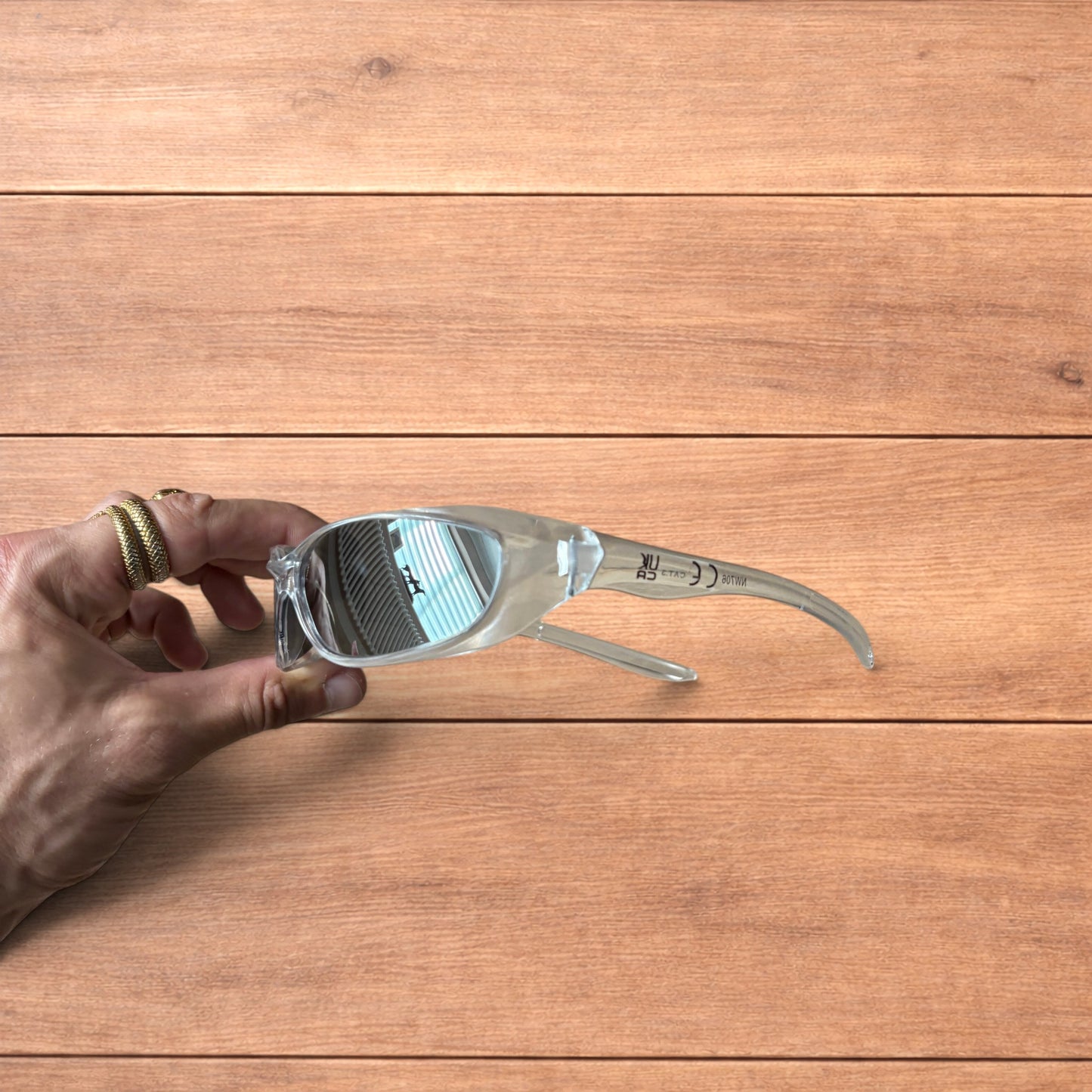 Insane mirrored sunglasses in clear frame with silver lense.