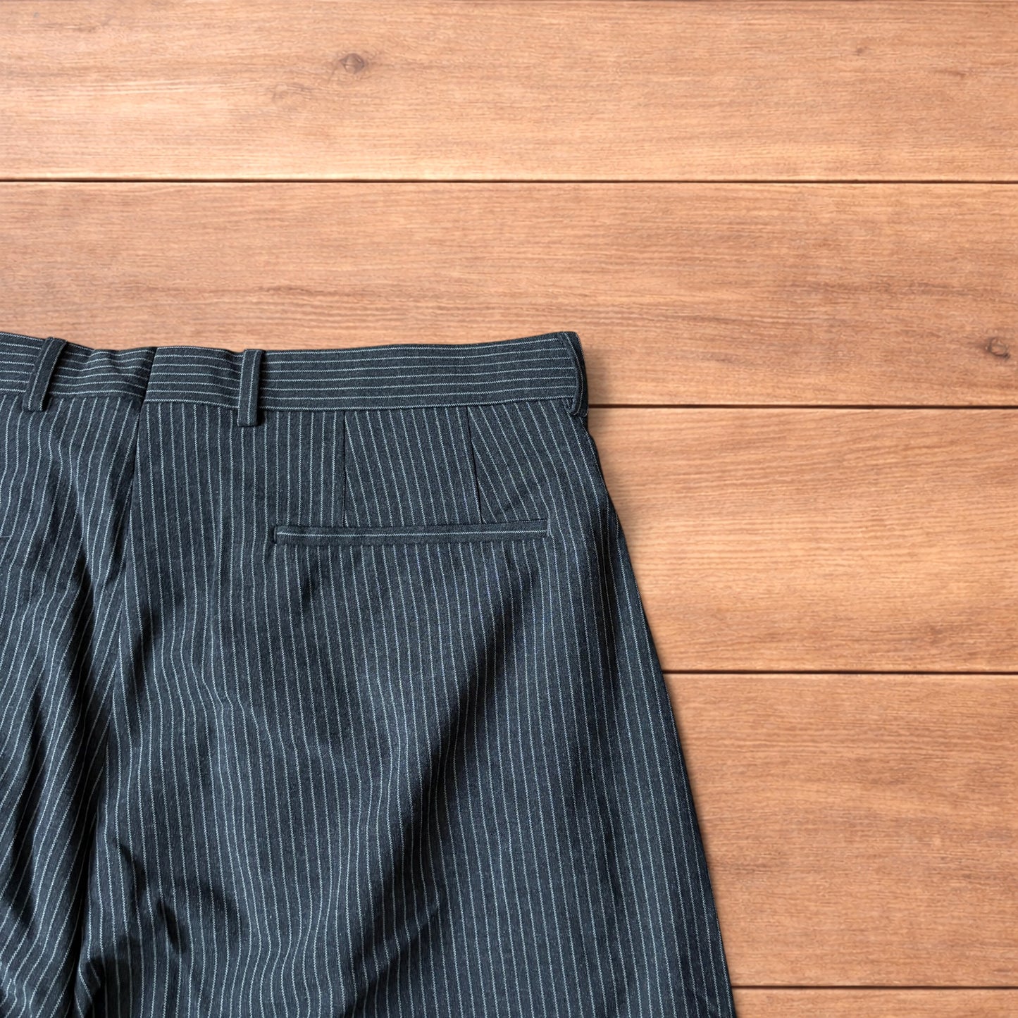Vintage style baggy wide leg pinstripe tailored trousers in charcoal grey.