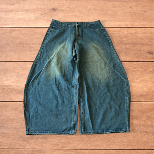 Vintage style baggy wide leg skater fit jeans with green fade in dark blue.
