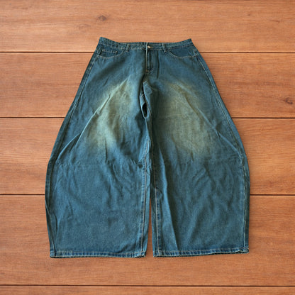 Vintage style baggy wide leg skater fit jeans with green fade in dark blue.