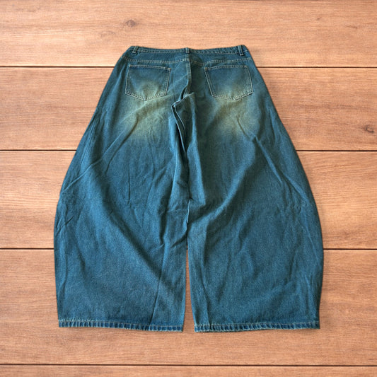 Vintage style baggy wide leg skater fit jeans with green fade in dark blue.