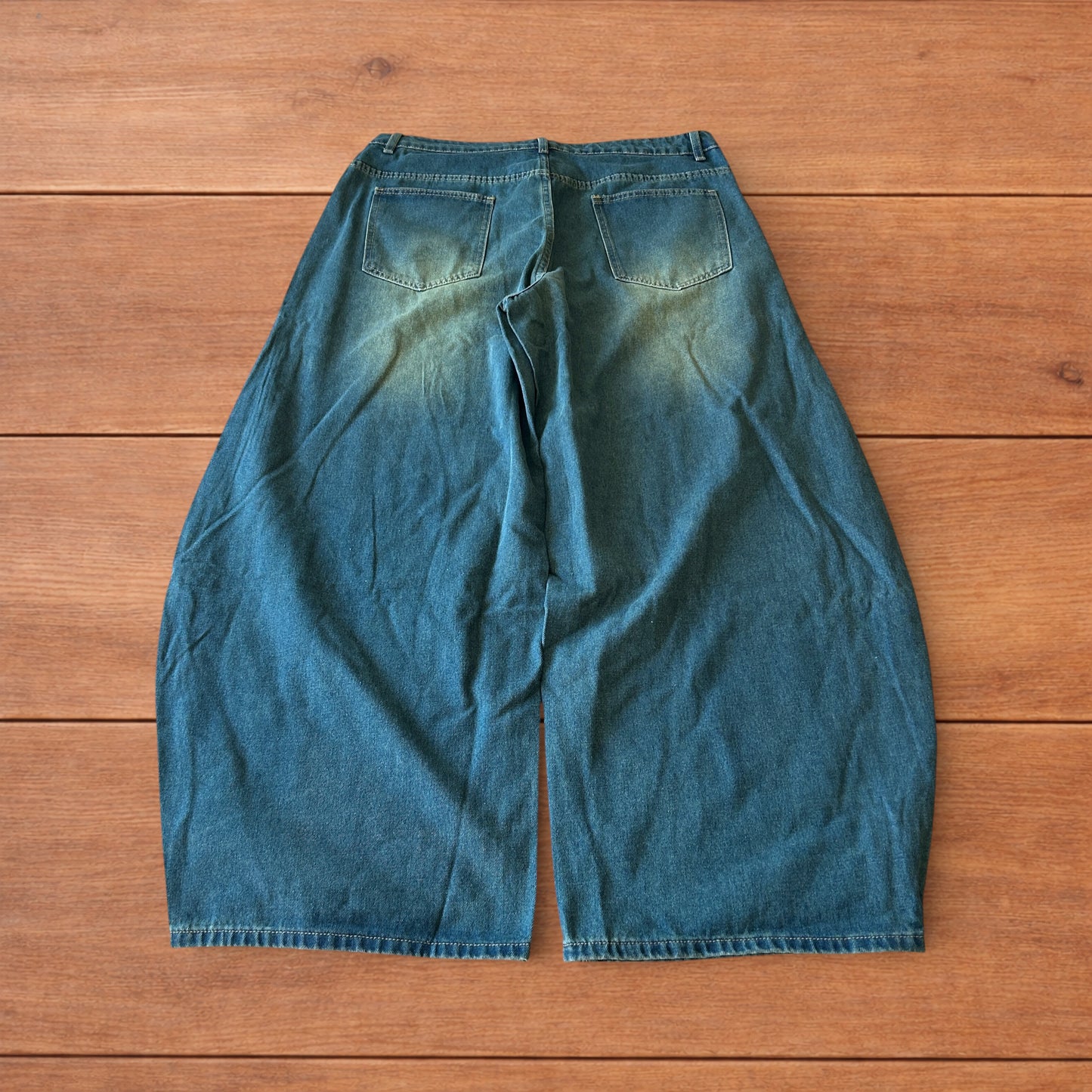 Vintage style baggy wide leg skater fit jeans with green fade in dark blue.