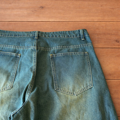 Vintage style baggy wide leg skater fit jeans with green fade in dark blue.