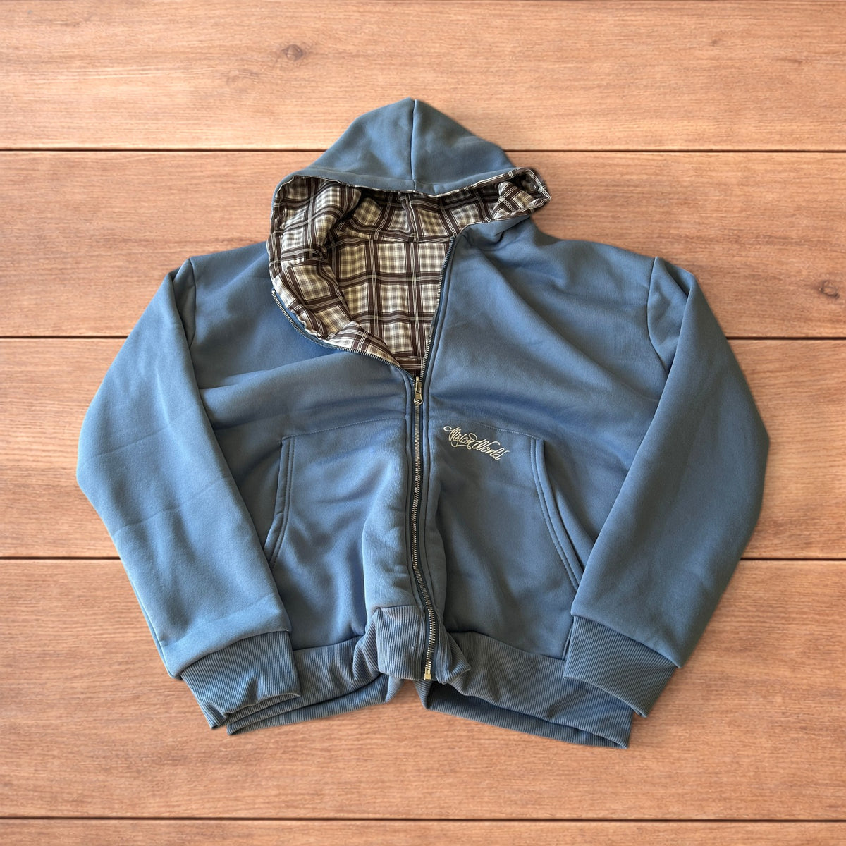 Oversized reversible zip-up hoodie in navy blue with checkered lining
