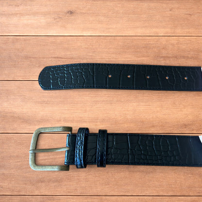 Vintage style faux leather snakeskin western cowboy belt in black with brass trim.