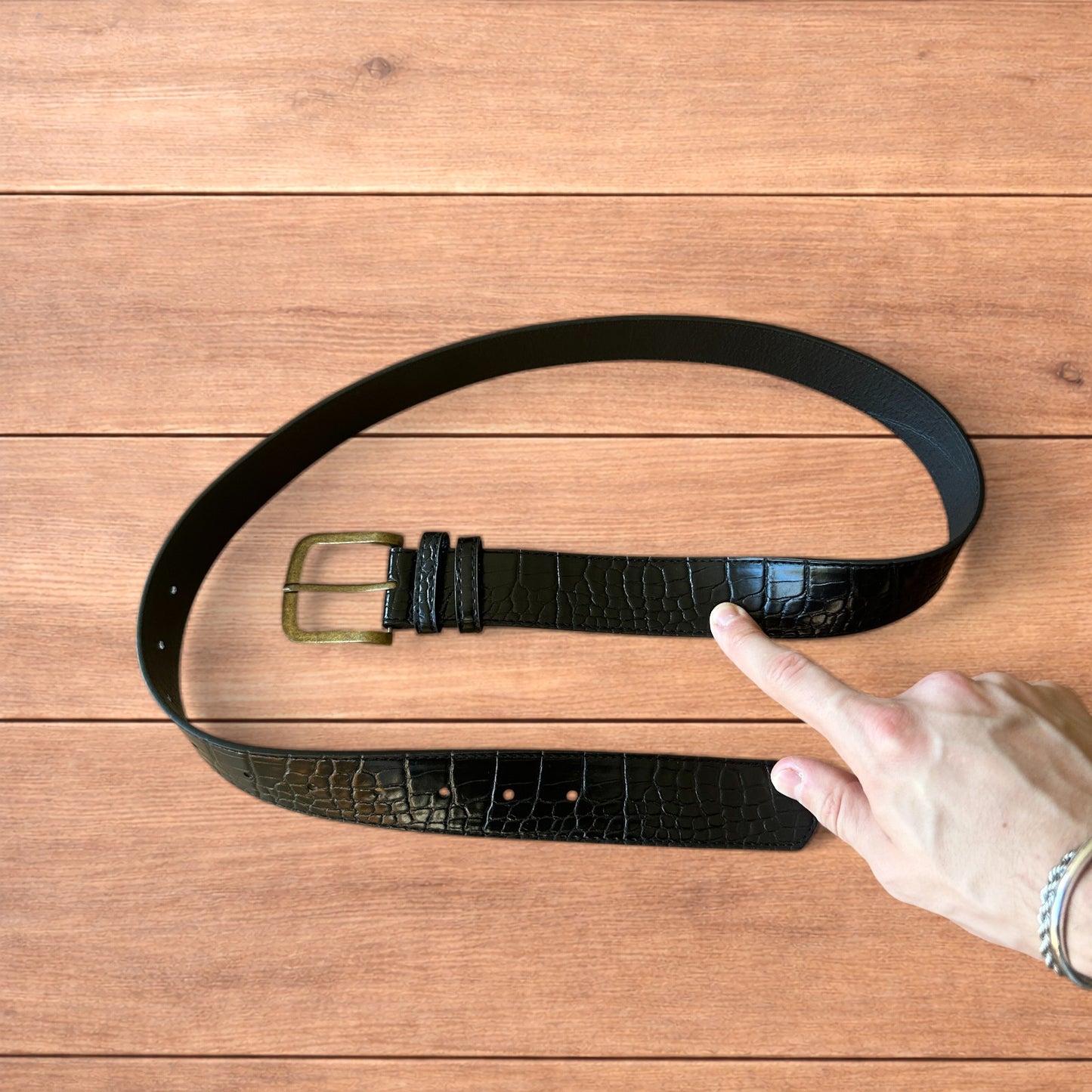 Vintage style faux leather snakeskin western cowboy belt in black with brass trim.