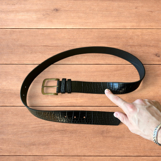 Vintage style faux leather snakeskin western cowboy belt in black with brass trim.