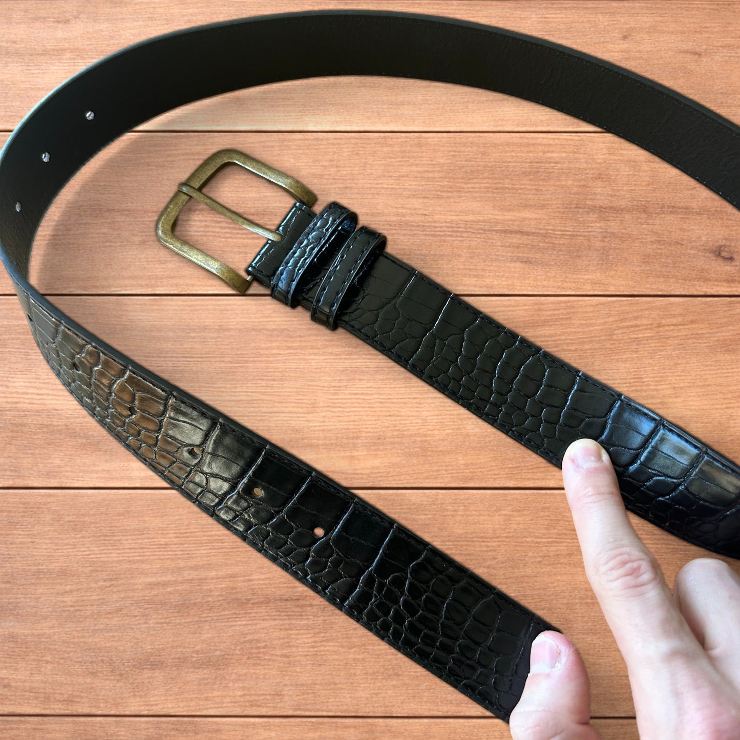 Vintage style faux leather snakeskin western cowboy belt in black with brass trim.