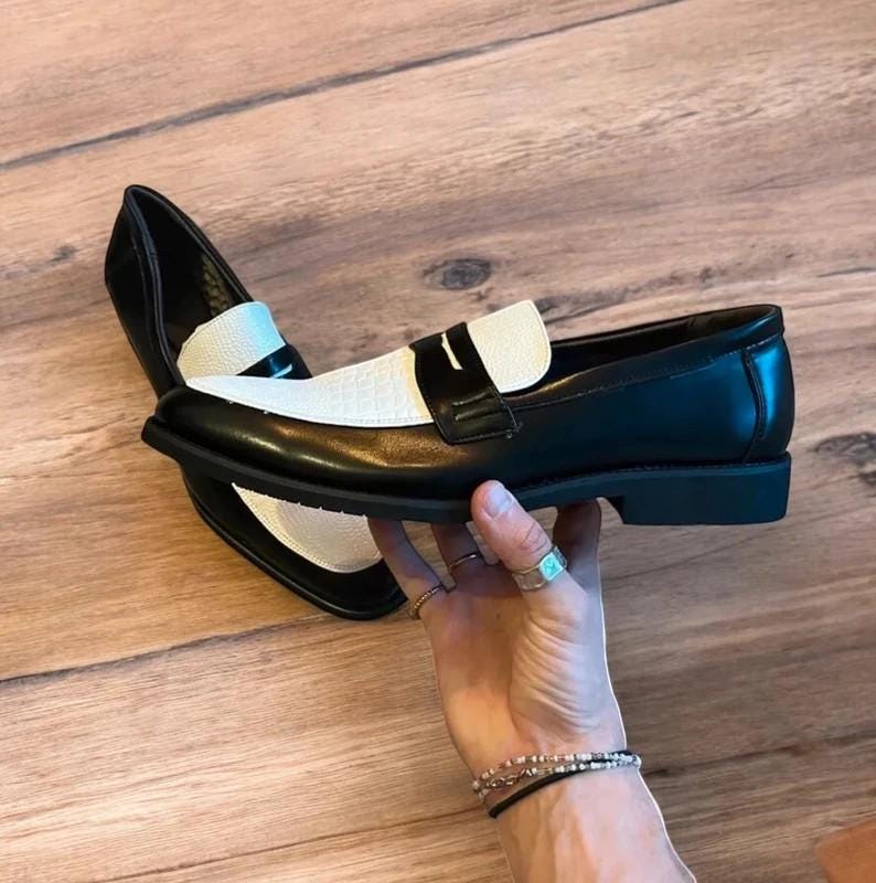 Lovely classic style loafers shoes in black and white design.