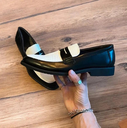 Lovely classic style loafers shoes in black and white design.