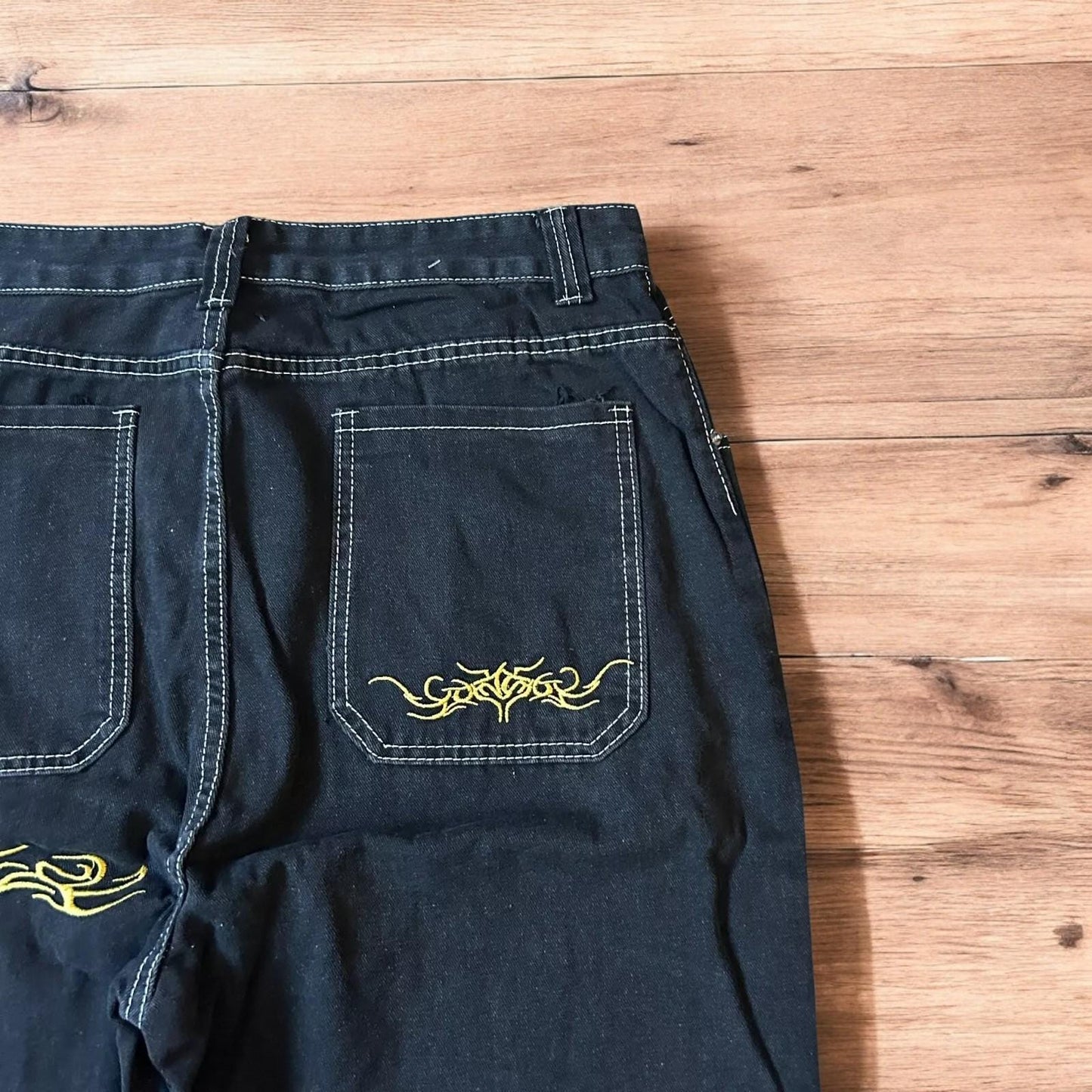 Insane baggy relaxed fit jeans in washed black with embroidery.