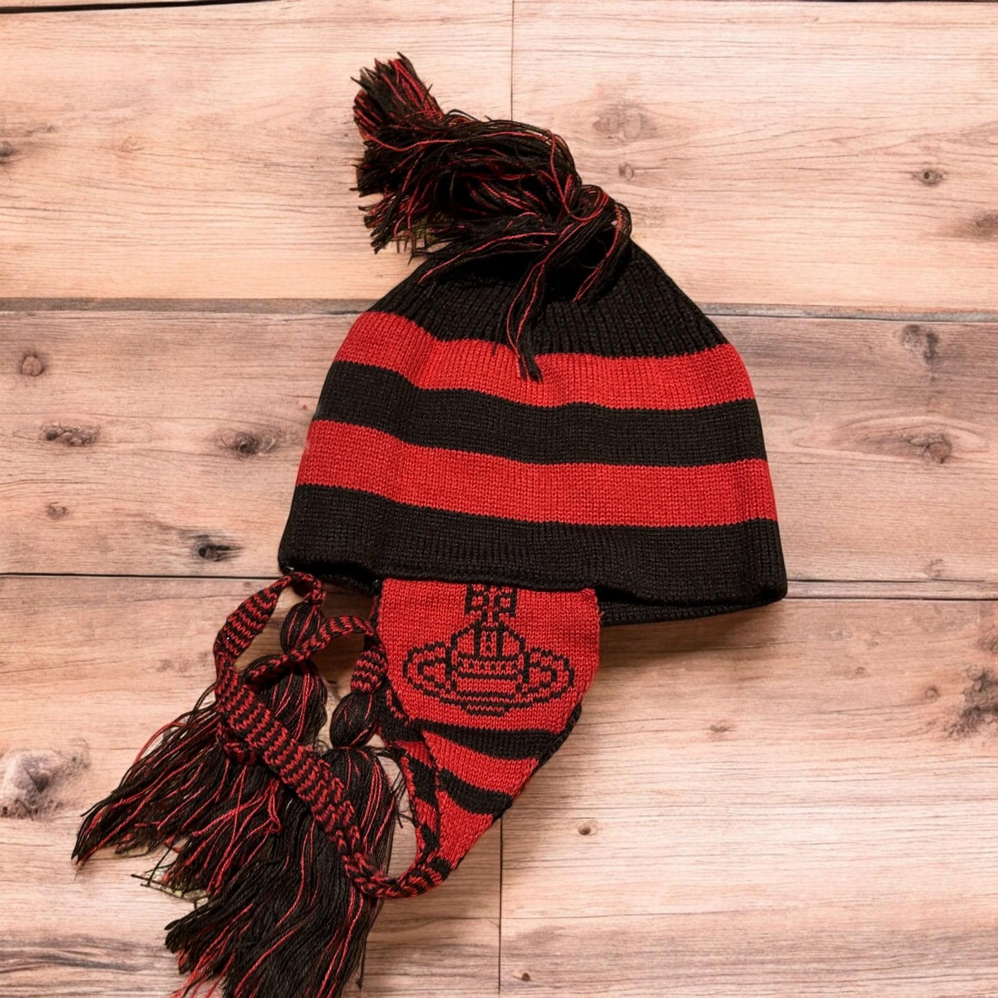 Lovely vintage style Dappy ear flap bobble hat in black/red stripes. One size.