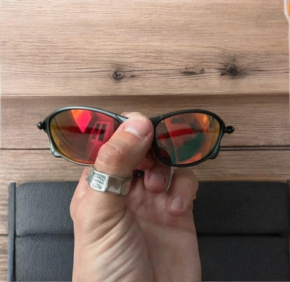 Insane metal frame sunglasses in black with red lense. One size.