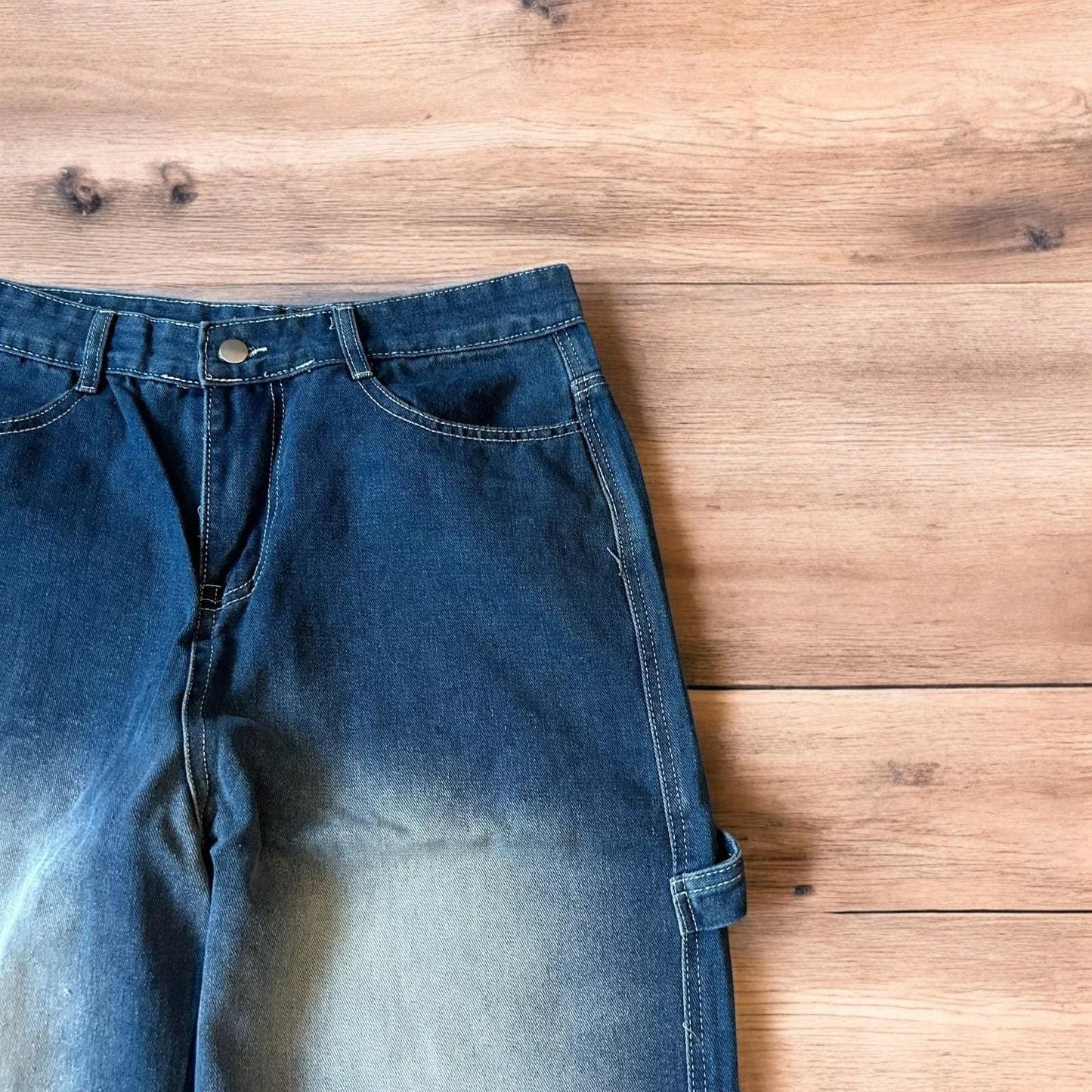 Insane baggy relaxed fit washed blue jeans with red embroidery.