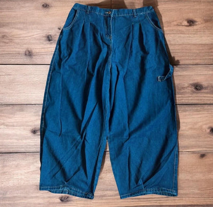 Vintage style baggy wide leg skater fit jeans in washed mid blue.