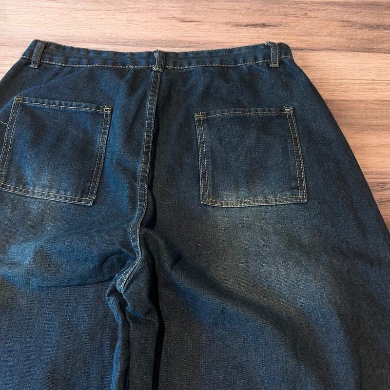 Incredible vintage style baggy wide leg skater fit jeans with fade in dark blue.