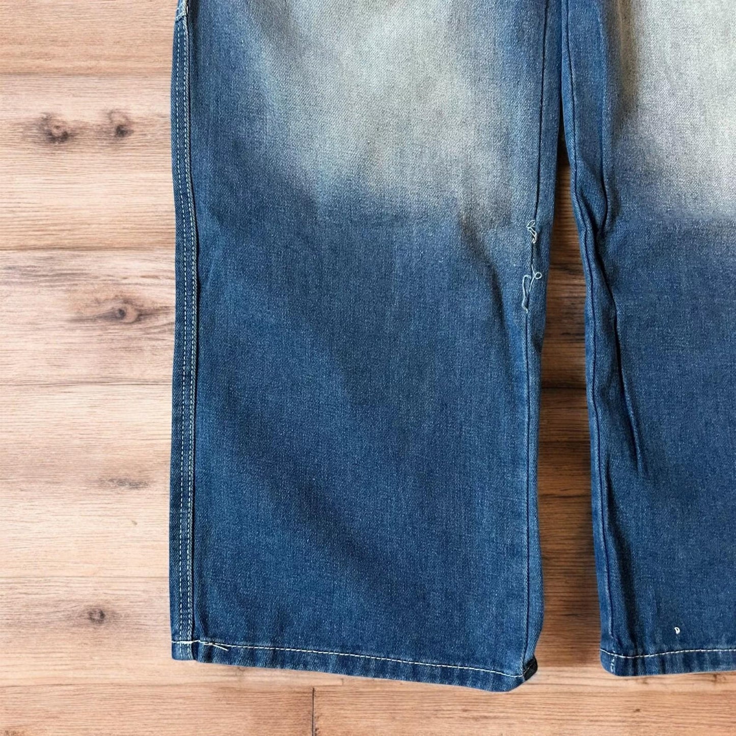 Insane baggy relaxed fit washed blue jeans with red embroidery.