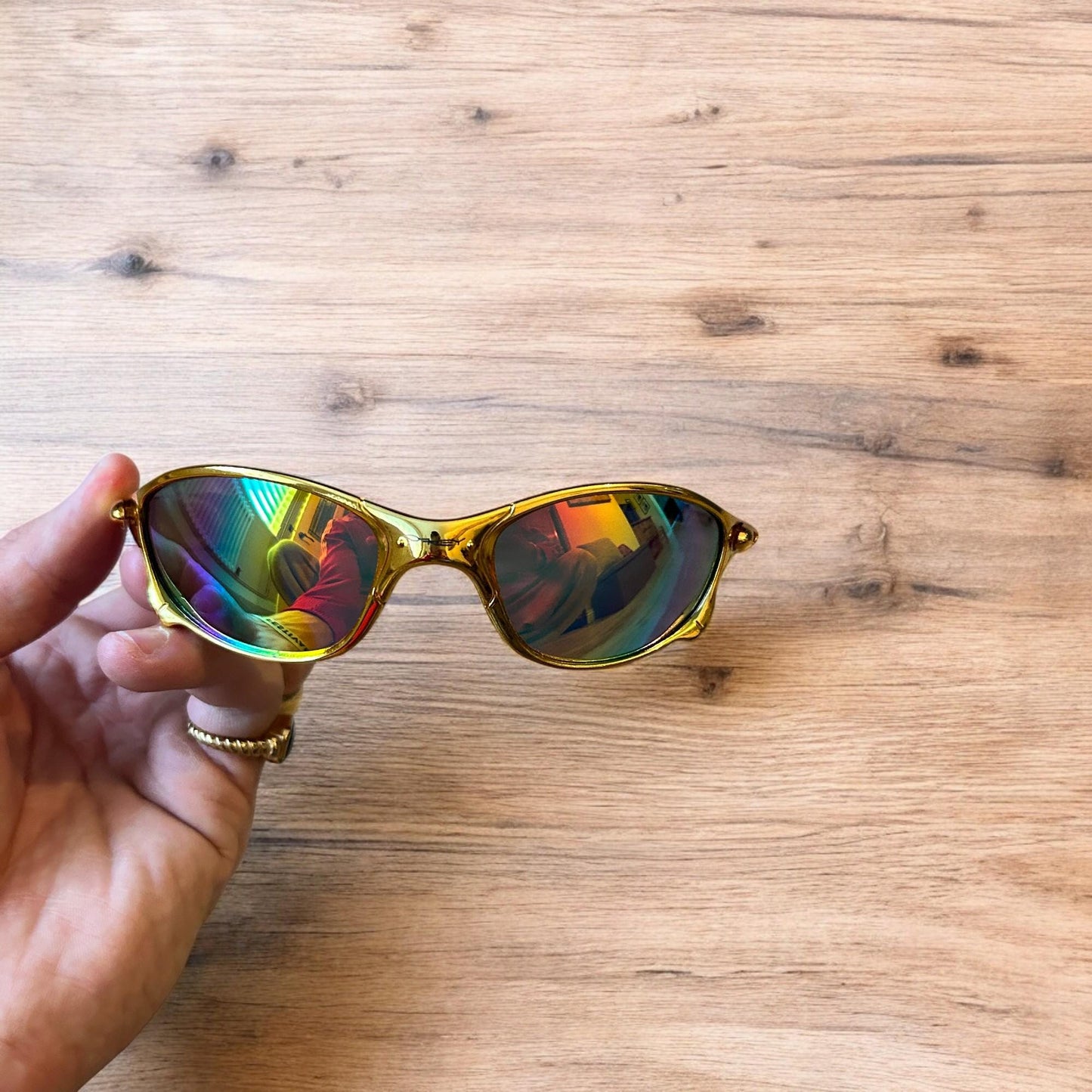 Insane metal frame sunglasses in gold with multicolour rainbow lense. One size.