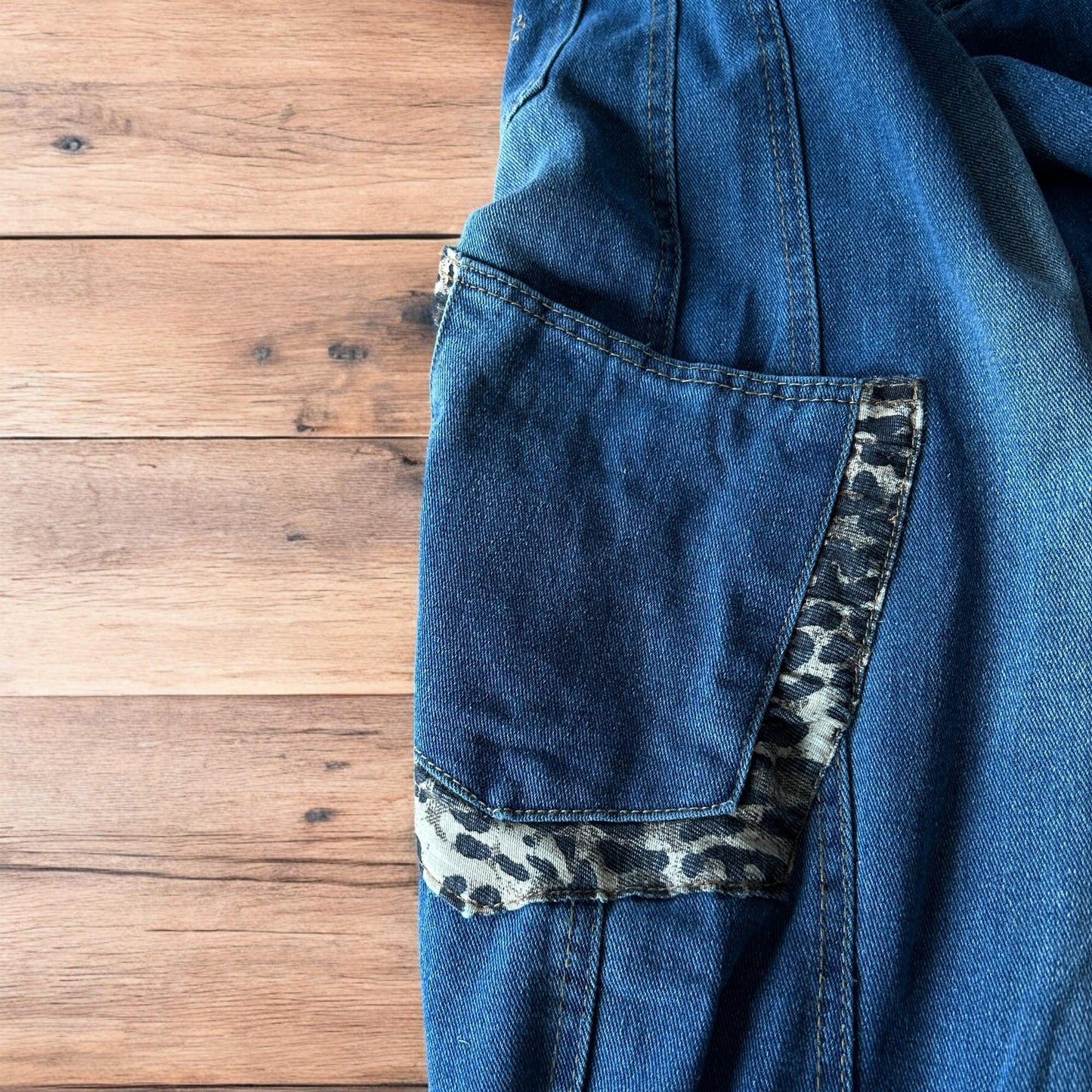 Incredible vintage style baggy wide leg skater fit jeans with leopard print in mid blue.