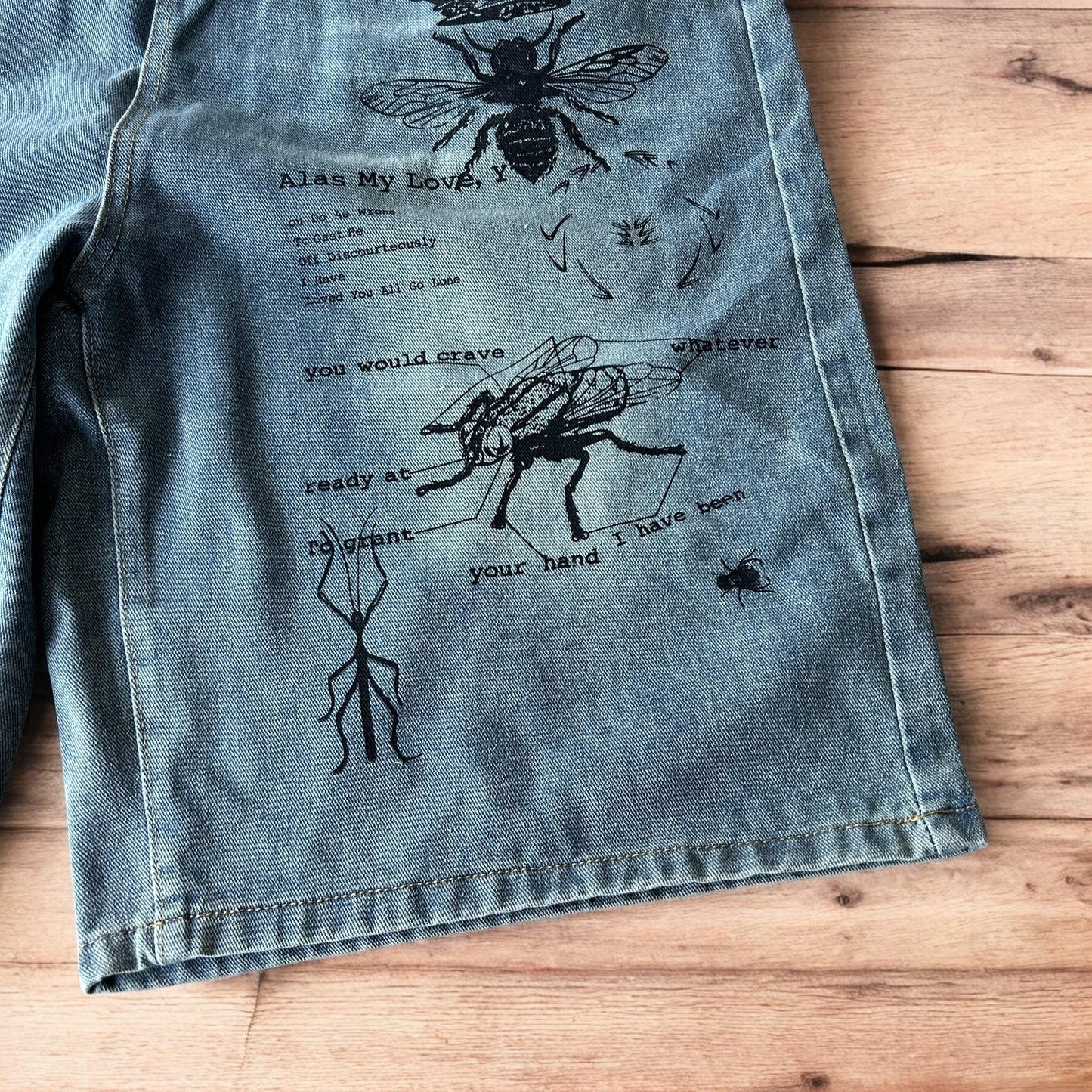 Incredible baggy wide leg denim shorts jorts with graffiti/graphic in light blue.