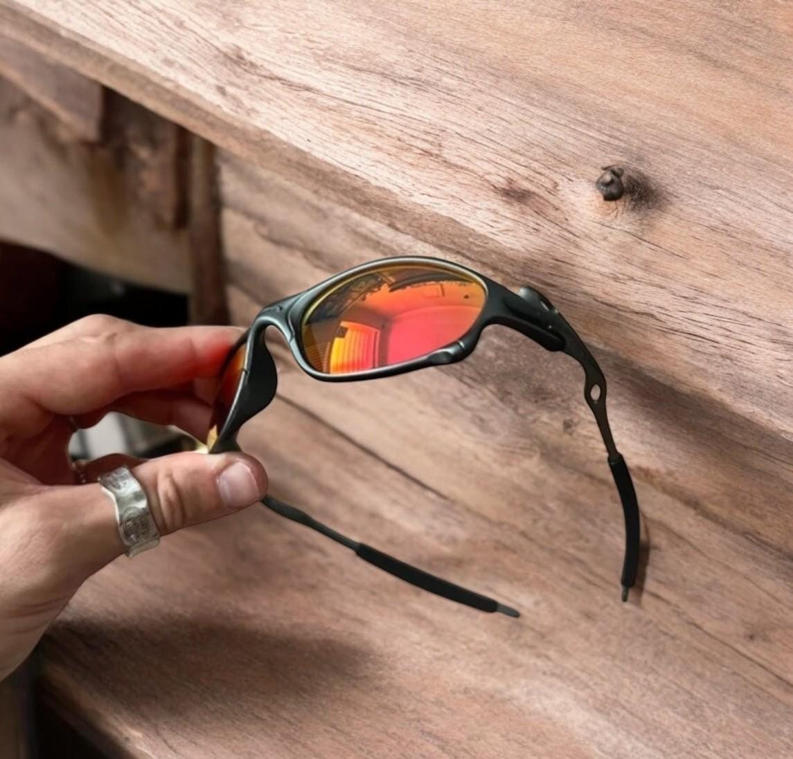 Insane metal frame sunglasses in black with red lense. One size.