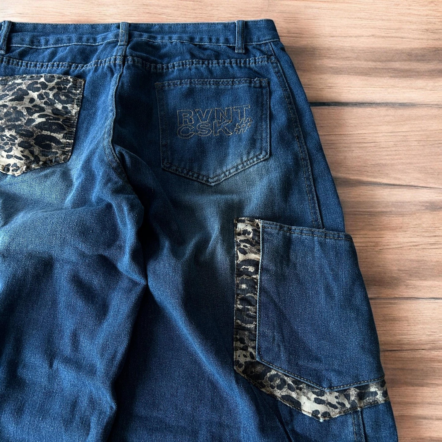 Incredible vintage style baggy wide leg skater fit jeans with leopard print in mid blue.