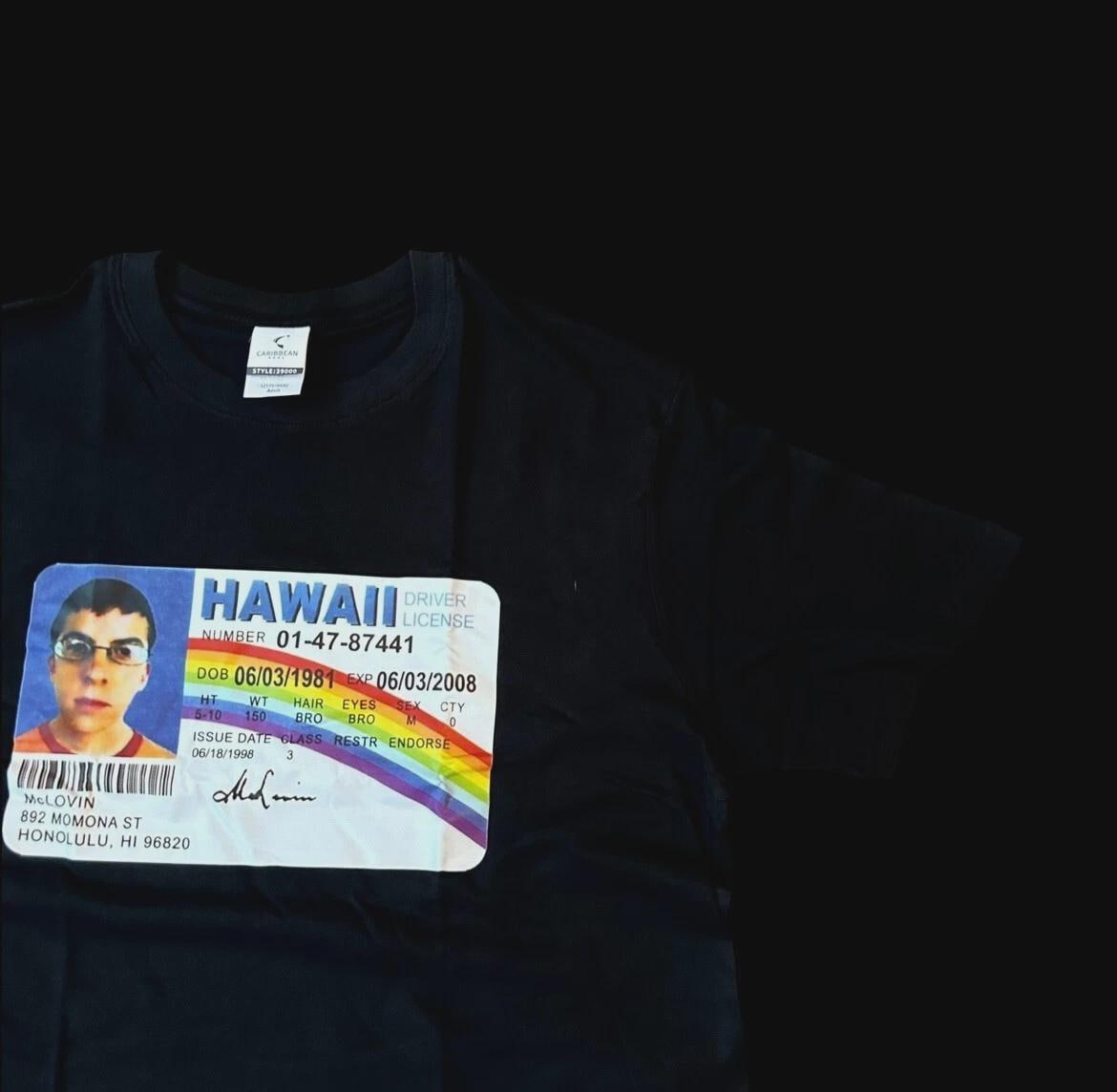 Novelty Superbad Mclovin I.D. T-shirt with front graphic print in black.