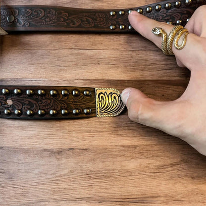 Vintage style faux leather western cowboy gothic belt in brown with silver trim.