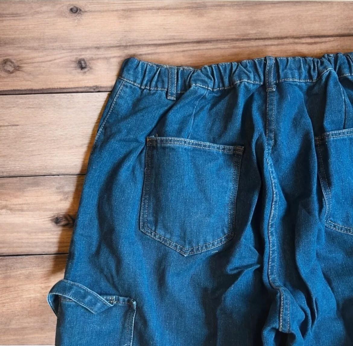 Vintage style baggy wide leg skater fit jeans in washed mid blue.