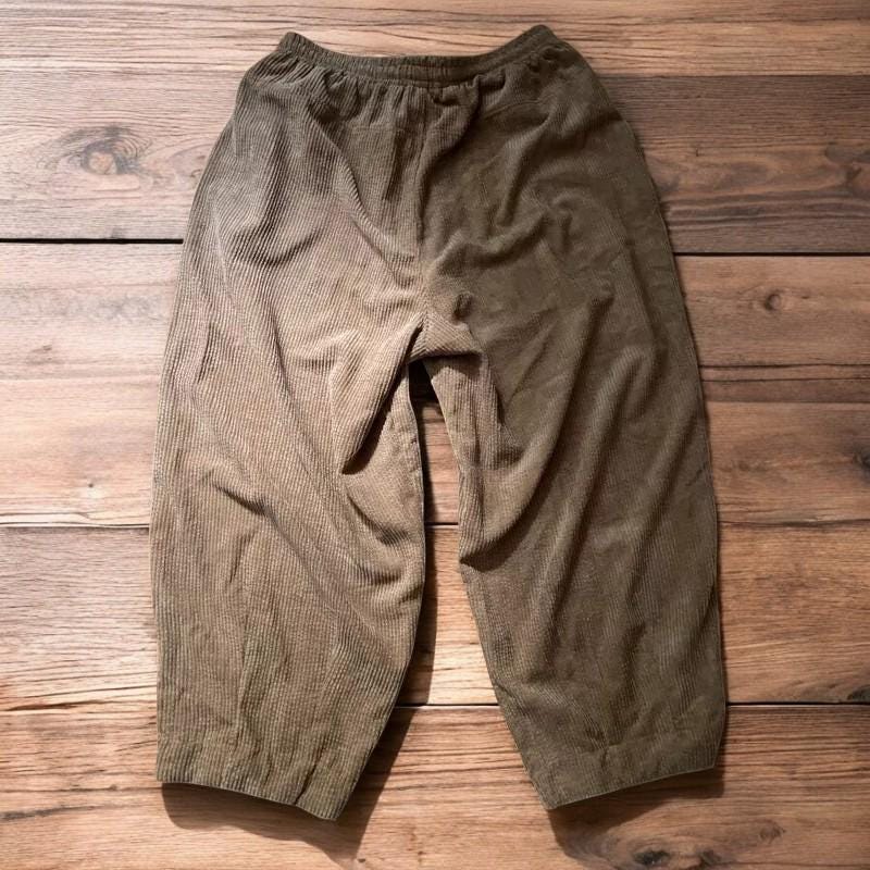Super baggy wide leg skater corduroy trousers in beige.