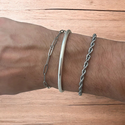 Trio of stainless steel bracelets in silver.