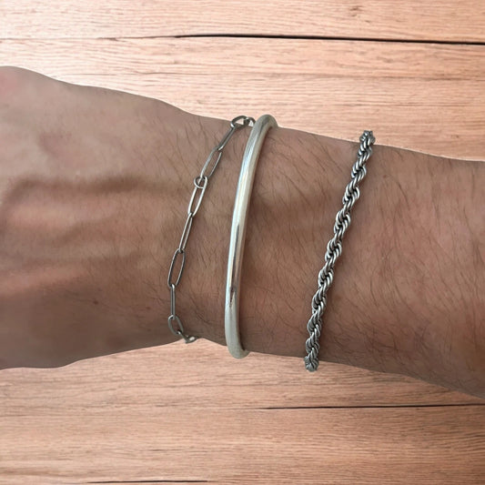 Trio of stainless steel bracelets in silver.